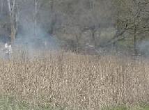 Smoke drifts across the terrain